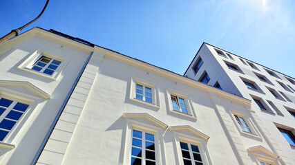 Modern apartment buildings on a sunny day with a blue sky. Facade of a modern apartment building. Modern residential apartment building complex condo.