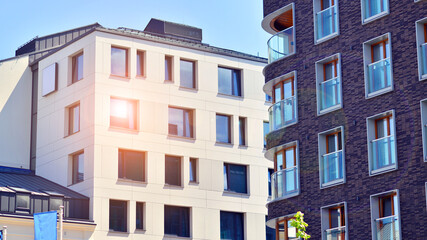 Modern apartment buildings on a sunny day with a blue sky. Facade of a modern apartment building. Modern residential apartment building complex condo.