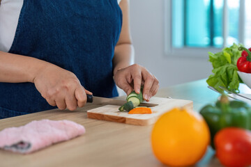 Healthy Cooking: Woman Chopping Vegetables in Bright Kitchen