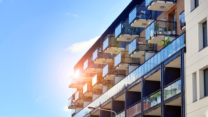 Modern apartment buildings on a sunny day with a blue sky. Facade of a modern apartment building....