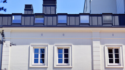 Modern apartment buildings on a sunny day with a blue sky. Facade of a modern apartment building. Modern residential apartment building complex condo.