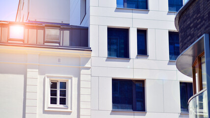 Modern apartment buildings on a sunny day with a blue sky. Facade of a modern apartment building. Modern residential apartment building complex condo.