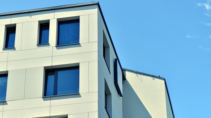 Modern apartment buildings on a sunny day with a blue sky. Facade of a modern apartment building. Modern residential apartment building complex condo.