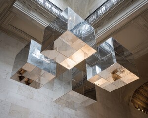 Reflective cube installation suspended in a building.