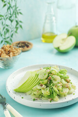 A plate with Waldorf salad, traditional American