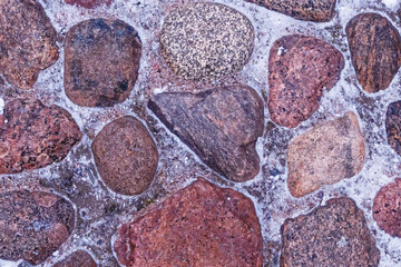 stone background from dark brown granite cobblestone square