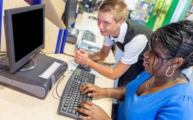 Teenage Students, Computer Studies. A pair of college friends working together in their school...