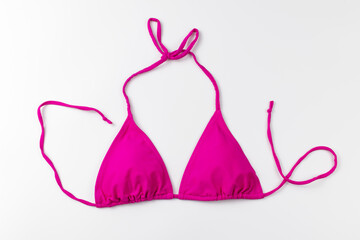 Beach pink bra on white background.