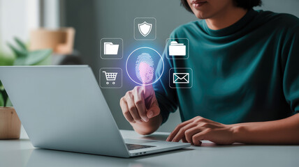 A person is pointing finger print. Concept of security and protection, as the person is using the laptop to access a secure system