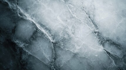 A close-up view of a sophisticated grey marble surface featuring intricate veins and textures, capturing the elegance of natural stone in a contemporary aesthetic.