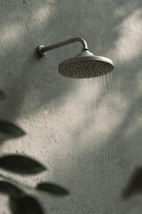 modern outdoor shower in minimalist spa area positioned on right side of frame