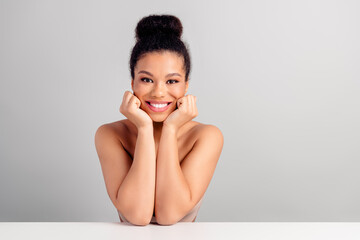 Smiling young woman with natural beauty, isolated on a white background, radiating confidence and...