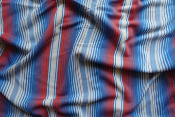 Backdrop - draped blue, red and white striped fabric