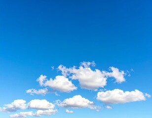 Obraz premium Minimal Blue Sky with Puffy White Clouds and Copy Space
