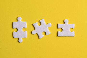Three white pieces of jigsaw for business partner connection concept