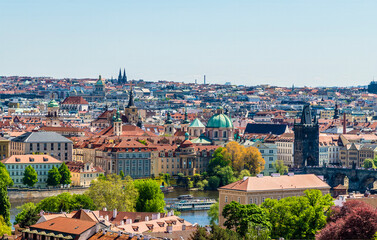 Fototapeta premium A view from the castle complex towards the Vltava river and central Prague in springtime