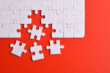 White puzzle with missing piece on red background. Flat lay. Top view