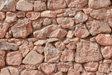 Old stone wall. Beautiful stone architecture. Wall texture. Wall patterns