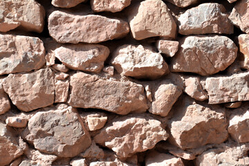 Old stone wall. Beautiful stone architecture. Wall texture. Wall patterns
