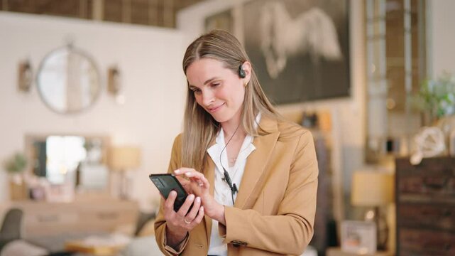 Associate scrolls smartphone, then smiles as camera circles her in slow motion