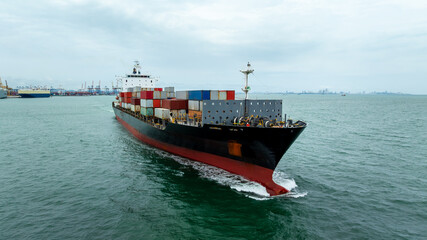 container ship carrying goods for international import export, business and industry regarding...