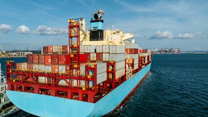 logistic cargo container ship sailing in sea to import export goods and distributing products to...