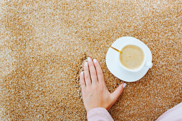 close-up. a cup of coffee on the beige Interior pile carpet.