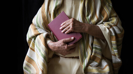 Old man holding a book