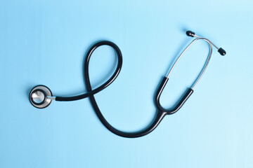 Stethoscope isolated on light blue background. Cardiology concept