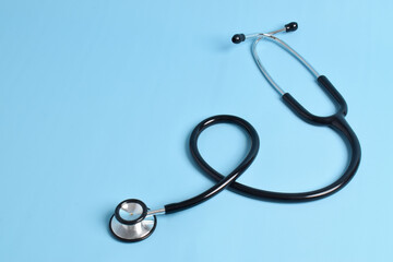 Stethoscope isolated on light blue background. Cardiology concept