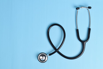 Stethoscope isolated on light blue background, with copy space fot text. Cardiology concept