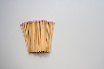 Pink matches sticks on bright background, copy space