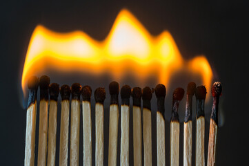 Burning matches. Abstract concept of burnout in couple, dark background