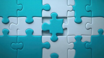 Close-up of blue and white puzzle pieces with one piece raised above the others symbolizing problem solving and incomplete task