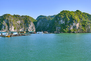 Halong Bay, a UNESCO World Heritage Site, during daytime. A floating village of fishermen.