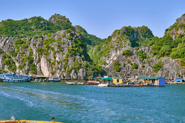 Halong Bay, a UNESCO World Heritage Site, during daytime. A floating village of fishermen.