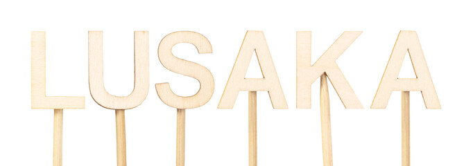 Lusaka, capital of Zambia, with wooden letters on white background, neutral aesthetics ideal for maps, education and African geography