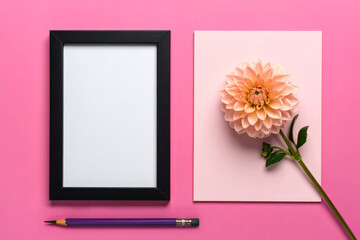 Frame mockup with flower and pencil on pink background flat lay art
