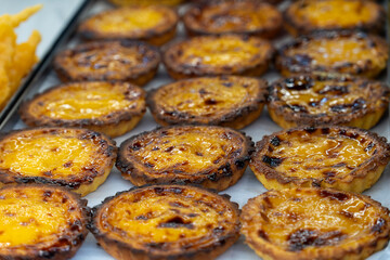 Making the famous Portuguese custard tarts in a pastry shop Lisbon