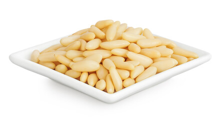 Shelled European pine nuts in ceramic bowl isolated on white background with full depth of field