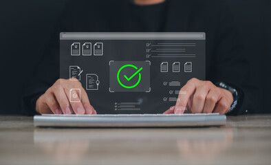 document verification process, with holographic checkmark and contract icons  person using a laptop suggesting technology and innovation in  professional representing online approval and certification