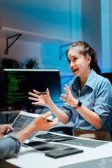 Team of programmers working late at night at a software development company, web developers, and...