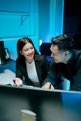 Team of coworkers working at night to develop or plan discussions, suggestions or ideas with business men and women working as a team in the evening.