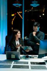 Team of coworkers working at night to develop or plan discussions, suggestions or ideas with...
