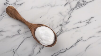 A wooden spoon dipped in creamy yogurt, standing isolated on a spotless white background. This image is a great fit for food - related projects, such as dairy product promotions, healthy eating guides
