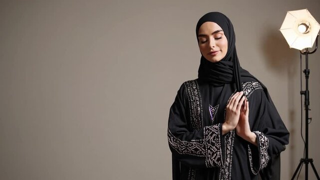 Beautiful arab middle-eastern women with traditional abaya dress in studio - Arabic muslim adult female portrait in Dubai, United Arab Emirates