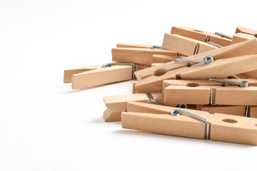 Pile of Wooden clothes pin isolated on white background with copy space for text