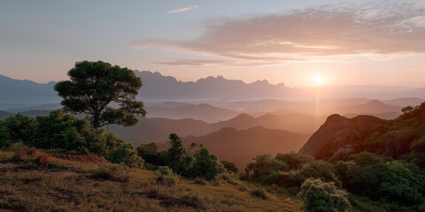 Scenic mountain sunrise over misty valley with lush greenery