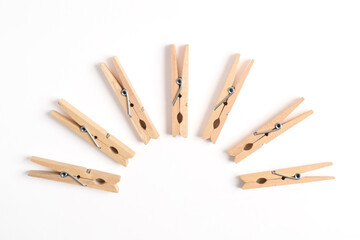 Wooden clothes pin isolated on white background. Top view, flat lay
