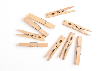 Wooden clothes pin isolated on white background. Top view, flat lay